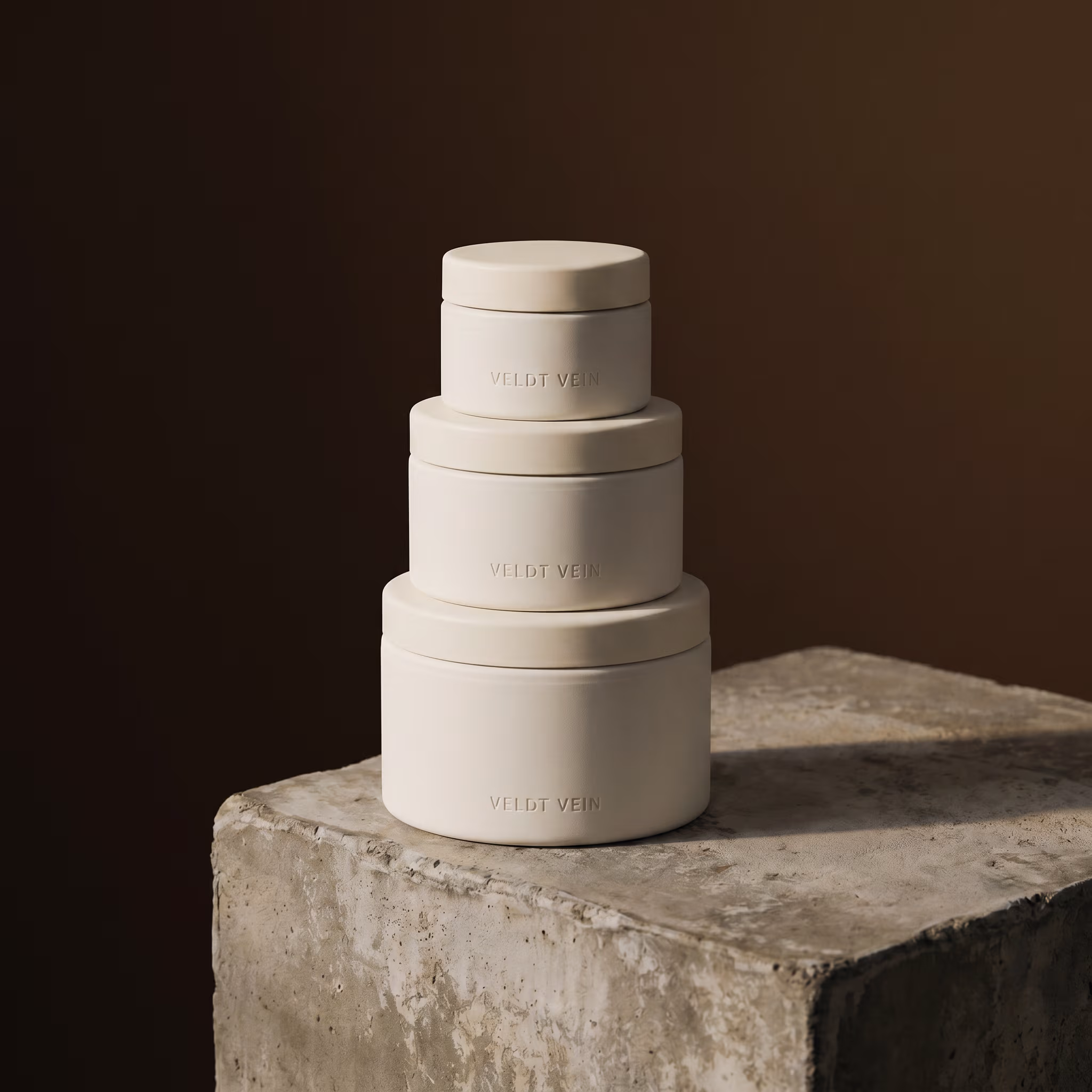 Three refill cartridges stacked — the inner vessel system that makes the capsule refillable.